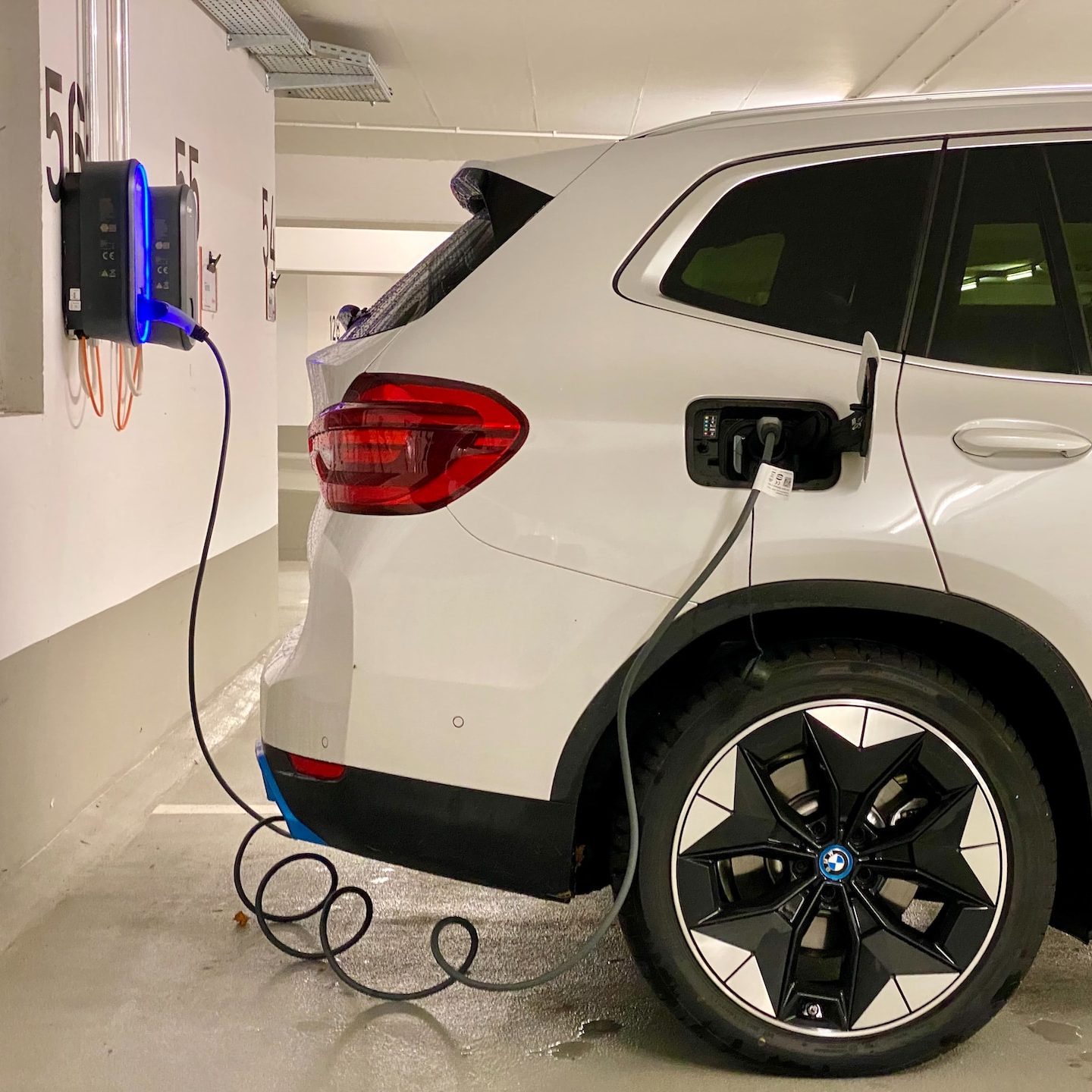 an electric car plugged in to a charging station